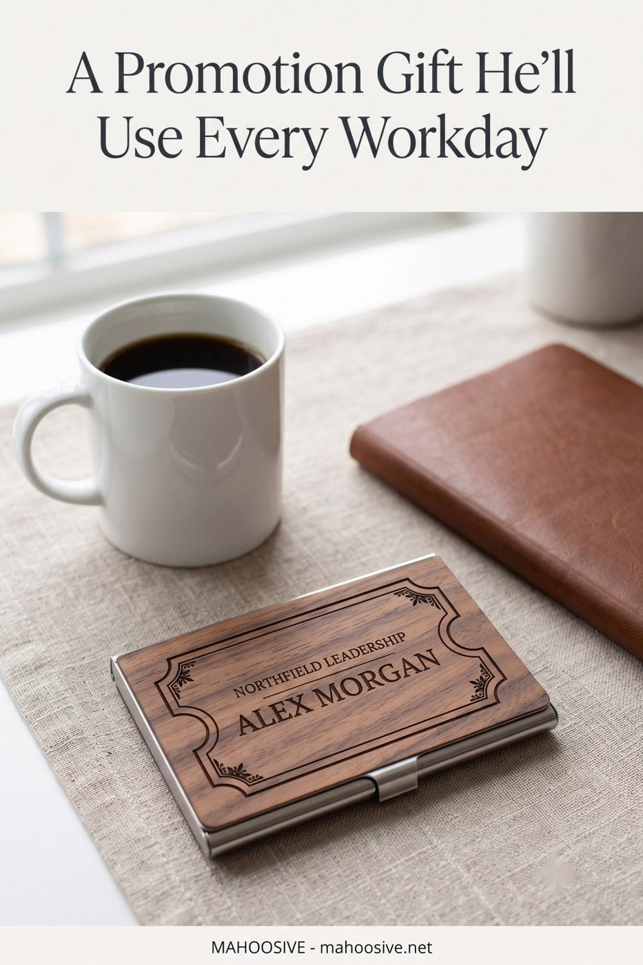 Engraved walnut business card case on a desk