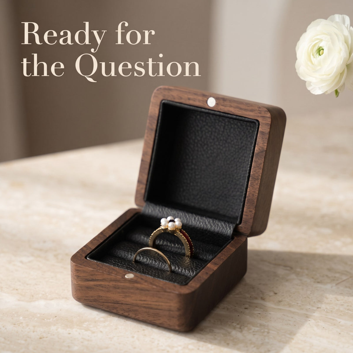 Walnut ring box held open during a proposal - Covenant - MAHOOSIVE
