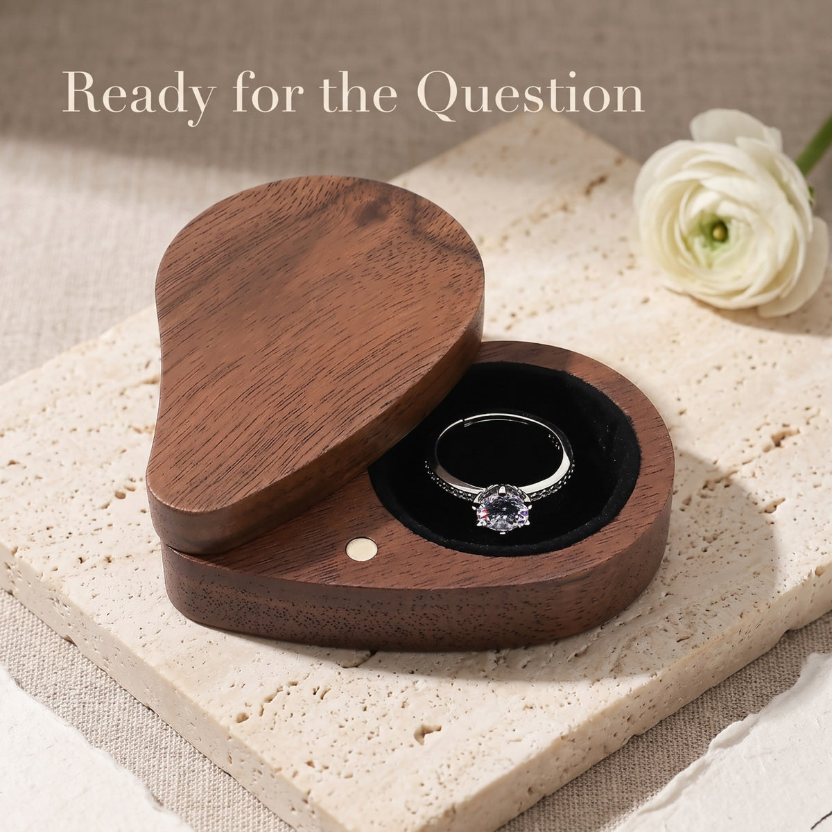 Walnut ring box held open during a proposal - Devotion - MAHOOSIVE