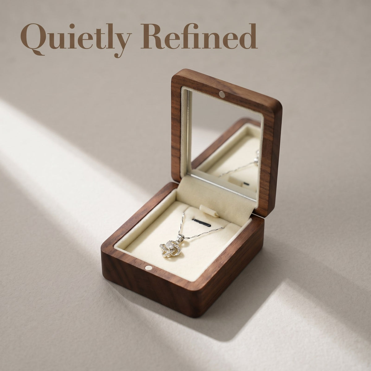 Walnut jewellery box closed, on a plain surface - Locket - MAHOOSIVE