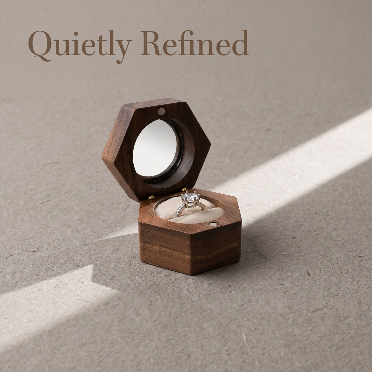 Walnut ring box closed, on a plain surface - Lucent - MAHOOSIVE