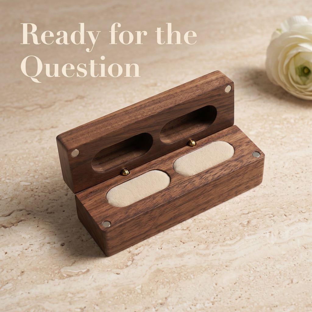 Walnut ring box held open during a proposal - Parallel - MAHOOSIVE