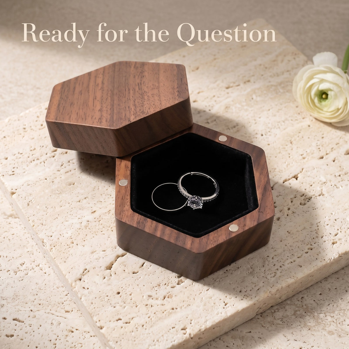 Walnut ring box held open during a proposal - Prism - MAHOOSIVE