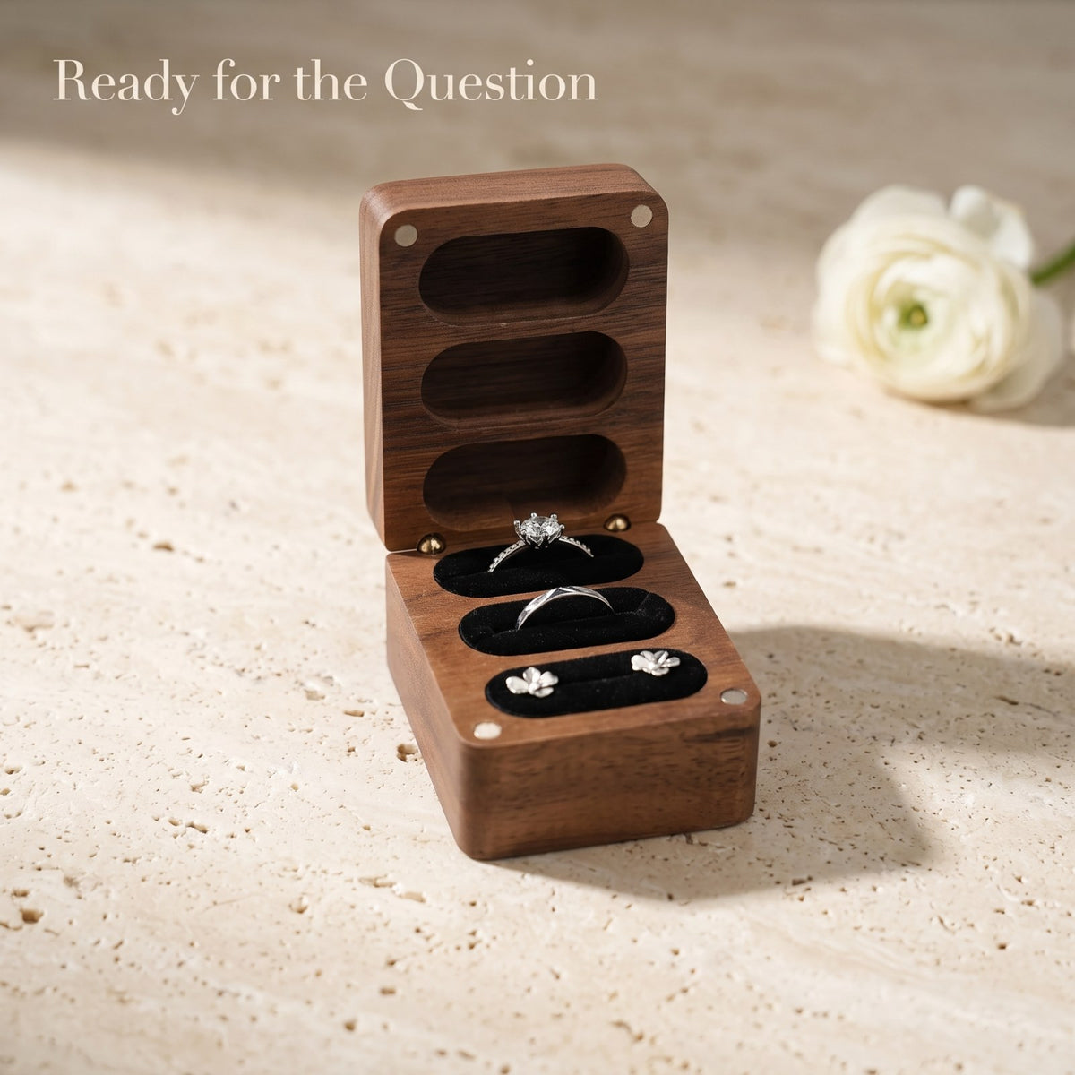Walnut ring box held open during a proposal - Trio - MAHOOSIVE